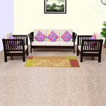 A walnut finish solid wood 5 seater sofa set consisting of three single sofas and two armchairs, with beige cushions and multicolored throw pillows, placed in a room with a carpet.