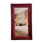 Rectangular rosewood maple finish mirror for bedroom or bathroom decor, displayed in an interior setting