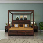 Wooden canopy bed in a bedroom setting with nightstands and decor.