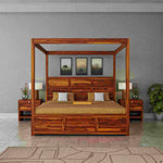 Wooden canopy bed in a bedroom setting with gray walls and decorative elements.