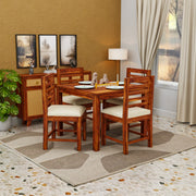 Wooden dining set with chairs and table in a room with beige walls and a window.