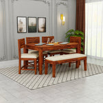Wooden dining set with table and chairs in a room with decor elements.