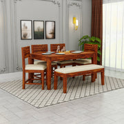 Wooden dining set with table and chairs in a room with decor elements.
