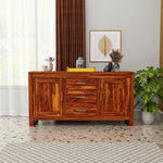 Wooden sideboard in a room with decor elements