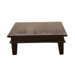 A rectangular solid wood pooja chowki with a walnut finish.