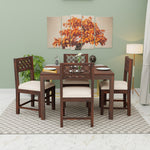 Dining set with wooden table and chairs in a room with a painting on the wall.