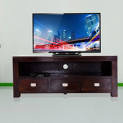 A wooden TV cabinet with drawers, in walnut finish, with a flat-screen TV on top and three drawers with silver handles.