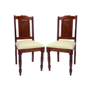 Two solid wood dining chairs with beige cushions, front view.