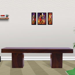 A solid wood sitting bench with a mahogany finish placed in a living room setting.