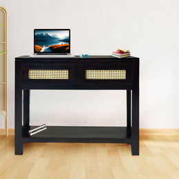 Black console table with a laptop on a white wall background