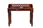 Wooden desk with intricate design on a white background