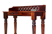 Wooden desk with intricate design on a white background
