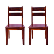 A pair of wooden dining chairs with a honey finish, showing the back and seat, set against a white background.