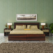 Bedroom with wooden bed, nightstands, and framed picture on a green wall.