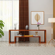Wooden console table in a room with decor elements like a Buddha statue and framed artwork.