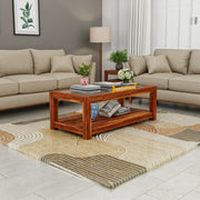 Living room with beige sofas, a wooden coffee table, and decorative items.