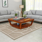 Living room with gray sofas, a wooden coffee table, and decorative items.