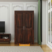 Wooden wardrobe with silver handles in a room setting, featuring Furniseworlds branding.
