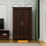 Wooden wardrobe in a room with a television and green curtain