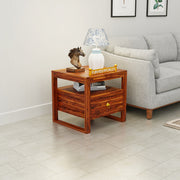 Wooden side table with decorative items in a living room setting
