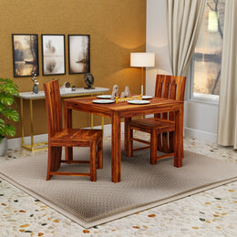 Wooden dining set in a room with a window and decor