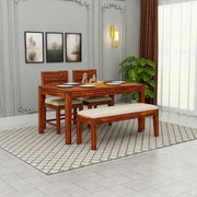 Wooden dining set with table, chairs, and bench in a room with gray walls and a window.
