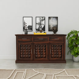 Wooden sideboard with decorative items against a white wall