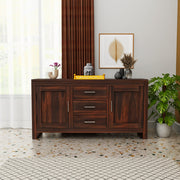 Wooden sideboard in a room with decor elements