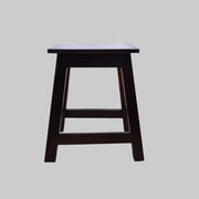 A solid wood side stool table with a walnut finish, featuring a square seat and a simple, sturdy design.