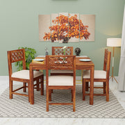 Wooden dining set with chairs and table in a room with a painting on the wall.