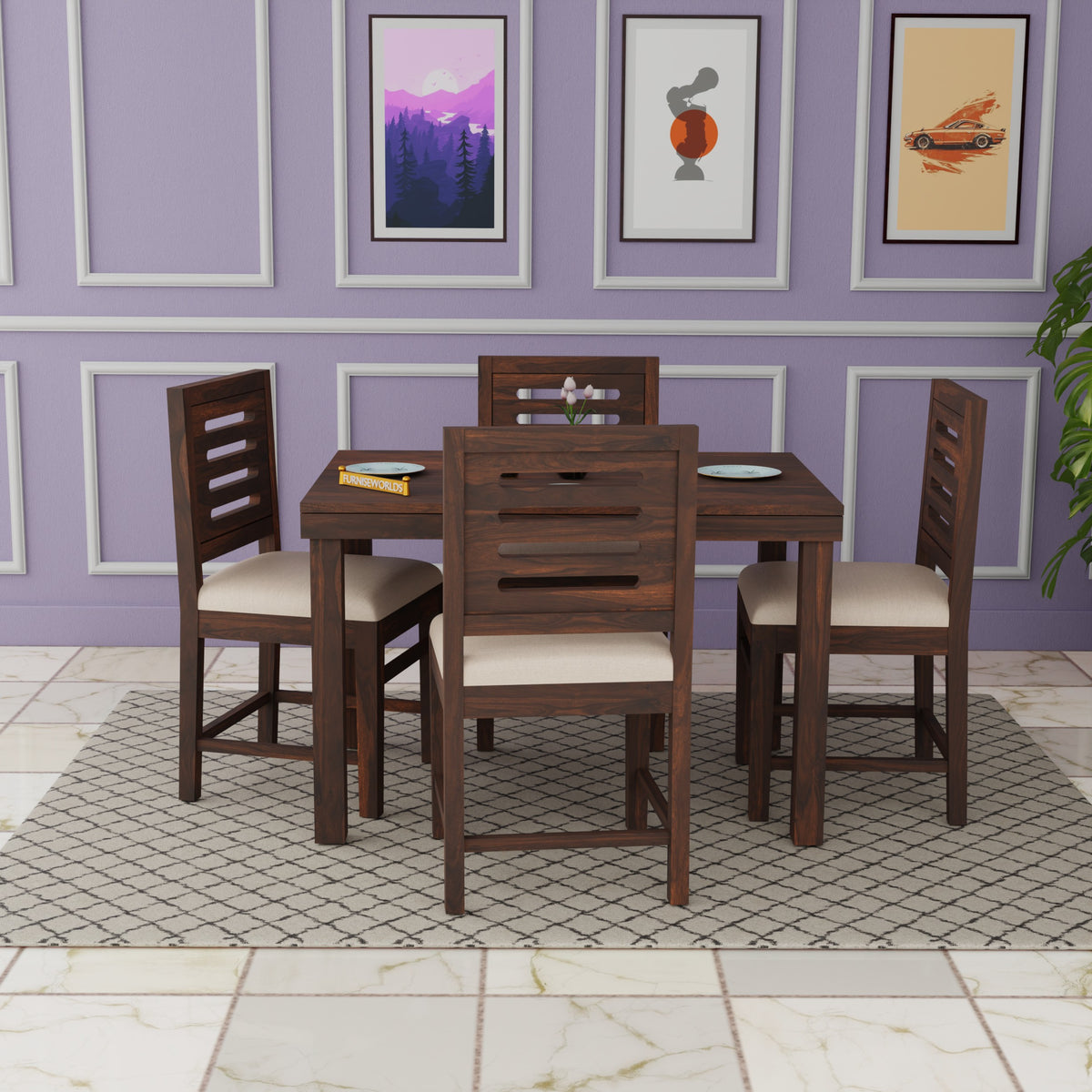 Dining set with wooden table and chairs against a purple wall with framed pictures.